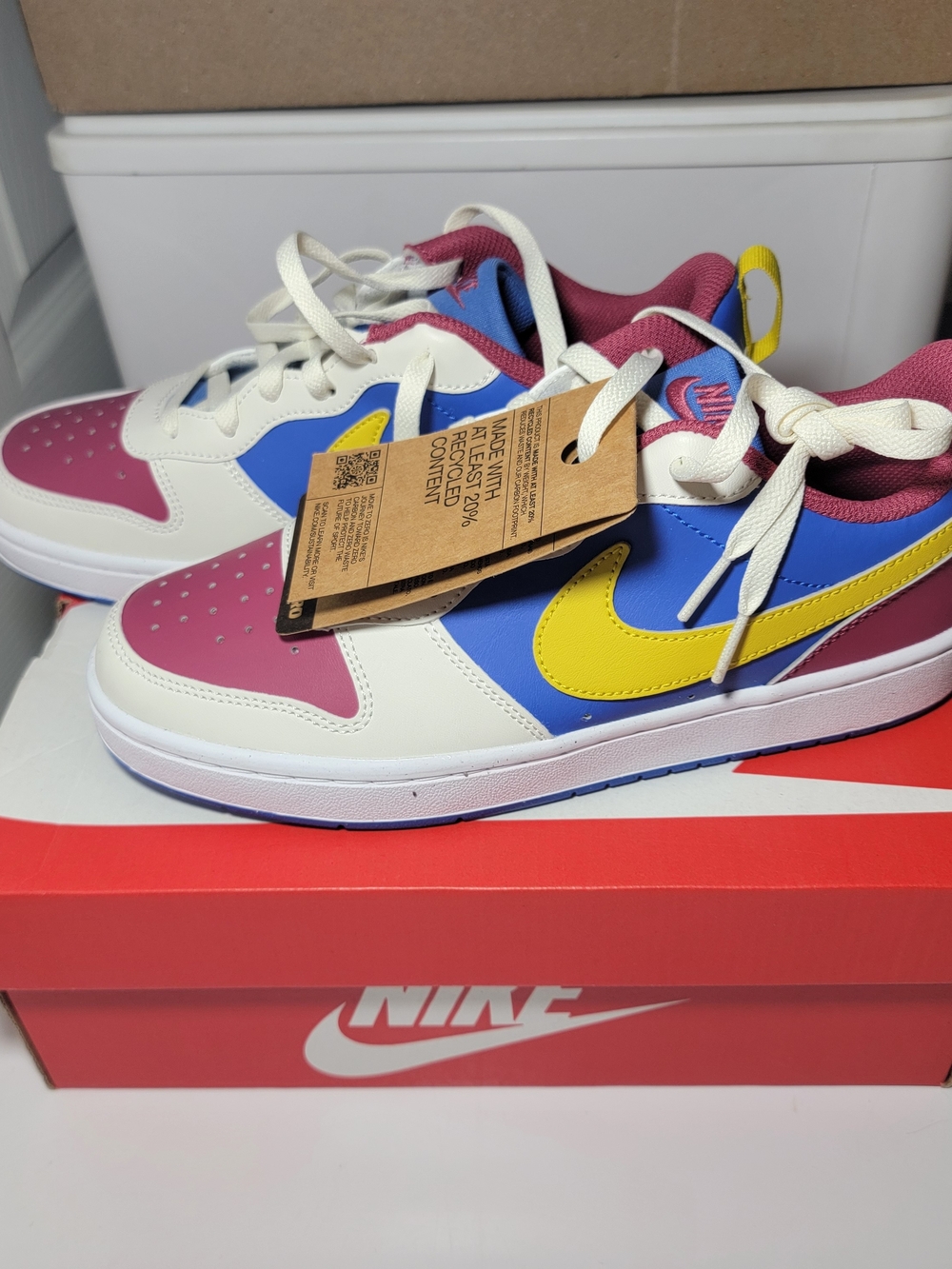 Nike Kids Low-Top Sneakers in White, Blue, Pink & Yellow